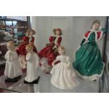 A Royal Doulton figurine 'Top of the Hill' together with eight other Doulton figures and a pair of