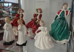 A Royal Doulton figurine 'Top of the Hill' together with eight other Doulton figures and a pair of