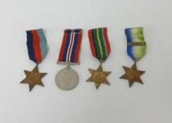 A set of WWII medals awarded to Mr.J.H.Dure (Salcombe, Devon) with original posting box.