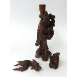 A carved wood figure, height 30cm, a carved wood carp fish, a Chinese dog.