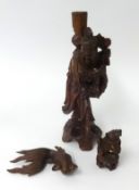 A carved wood figure, height 30cm, a carved wood carp fish, a Chinese dog.