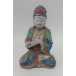 An Asian wood and painted seated Buddha, height 39cm.