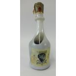 A Salvador Dali design pottery decanter Brandy Conde de Osborne, 75cl, wax sealed, 29cm high.