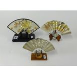 Three decorative Japanese silver fans.