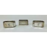 A pair of silver napkin rings and another with engined turned decoration (3), approx 3.7gms.