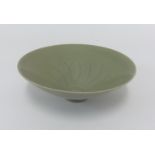 A small celadon style shallow bowl, diameter 17.50cm.
