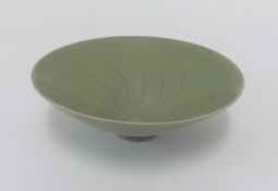 A small celadon style shallow bowl, diameter 17.50cm.