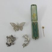 Two antique tie pins, art nouveau white metal brooch and two others.