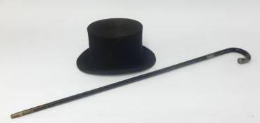 A 'Battersby and Co London' top hat (size 7 1/4) and a walking cane with inscriptio