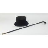 A 'Battersby and Co London' top hat (size 7 1/4) and a walking cane with inscriptio