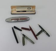 A Conway Stewart fountain with 14ct nib together with three Parker fountain pens, Esterbrook pen and