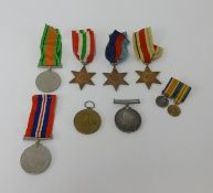 A pair of Great War and WWII medals awarded to Mr E.E.Atfield also two miniatures and original