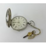 A white metal nickel open face half hunter key wind pocket watch in fitted case, marked 'Barraud &