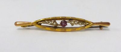 An antique 9ct gold brooch set with pearls and amethyst.