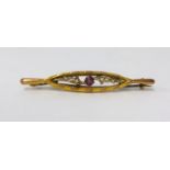 An antique 9ct gold brooch set with pearls and amethyst.