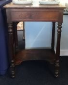 A 19th century rosewood reading stand, with rising lid, single drawer and lower tier, lacks hinges