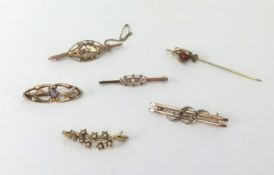 Three antique gold brooches marked 9ct, (5.5gms), two other brooches unmarked and a tie pin (6).