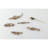 Three antique gold brooches marked 9ct, (5.5gms), two other brooches unmarked and a tie pin (6).