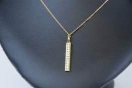 An 18ct diamond pendant and gold chain.