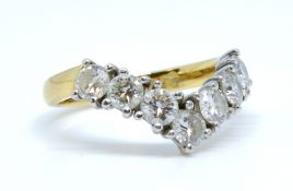 An 18ct diamond wishbone ring set with seven round cut diamonds, approx 1.57 cts total weight,