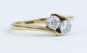 An 18ct two stone diamond ring, approx 0.50cts, size L.