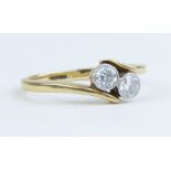 An 18ct two stone diamond ring, approx 0.50cts, size L.