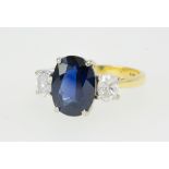 A good 18ct sapphire and diamond three stone ring, size N.