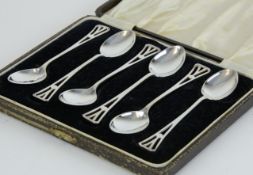 A set of six silver teaspoons of arts and crafts design, circa 1943, cased.
