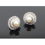 Earrings, a pair of hand crafted and platinum earrings consisting of a double row of round