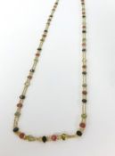 An 18ct yellow gold and multi stone necklace, approx 10.9gms.