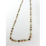 An 18ct yellow gold and multi stone necklace, approx 10.9gms.