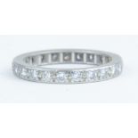 A platinum and diamond full band eternity ring, size N.