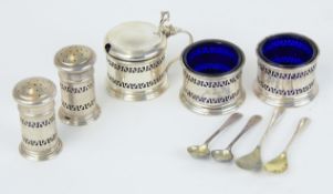 A five piece silver cruet set, cased.