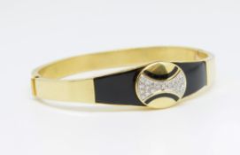 An 18ct yellow gold onyx and diamond set bangle, approx 25.4gms, marked '18k'.