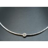 An 18ct diamond set collar, set with a circular diamond cluster of contemporary design.