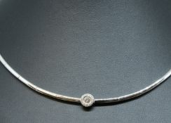 An 18ct diamond set collar, set with a circular diamond cluster of contemporary design.