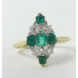 An emerald and diamond marquise ring set in yellow gold, unmarked, size P.