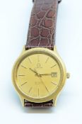 Omega, a gents gilt metal quartz De Ville wristwatch with date.
