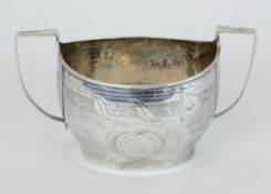 A Geo V sugar bowl with handles and incised decoration, approx 4.64oz.