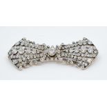 An antique gold and silver set diamond bow brooch consisting of 185 old cut and rose cut diamonds,