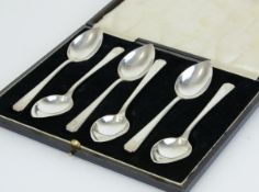 A set of six silver grapefruit spoons of art deco design, approx 5.64oz, cased together with a set