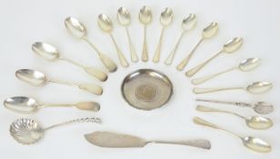 An assortment of silver including various teaspoons, butter knife, caddy spoon dish etc, approx 10.