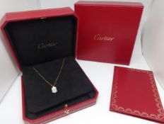 Cartier, an 18ct yellow gold necklace set with a mother of pearl set pendant, purchased new 2009