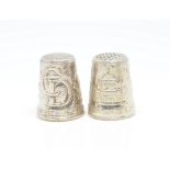 A pair of modern silver 'The Heritage Collection' thimbles.