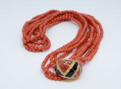 A coral five strand necklace with an 18ct diamond end clasp of art deco design.