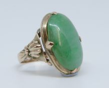 An antique jade set yellow gold ring marked '14k', size J, stone size approx 20mm x 10mm.