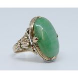 An antique jade set yellow gold ring marked '14k', size J, stone size approx 20mm x 10mm.