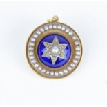 A circular pendant with enamel and pearl decoration, diameter 23mm.