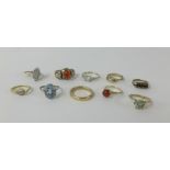 A 22ct wedding band (8.2gms), two 14ct dress rings (5.70gms) and various unmarked dress rings (