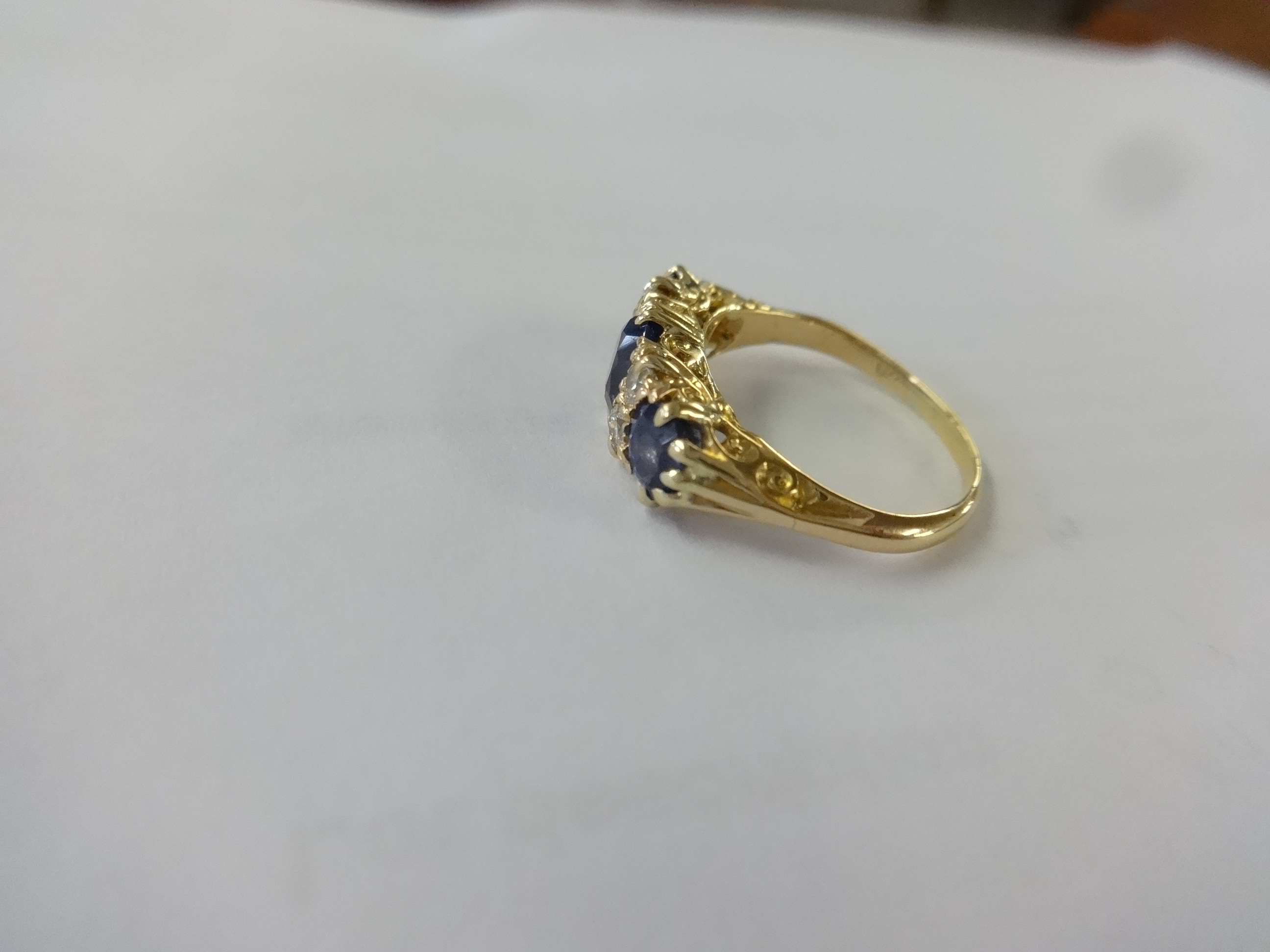 A sapphire and diamond ring set in yellow gold, unmarked, size K. - Image 2 of 5